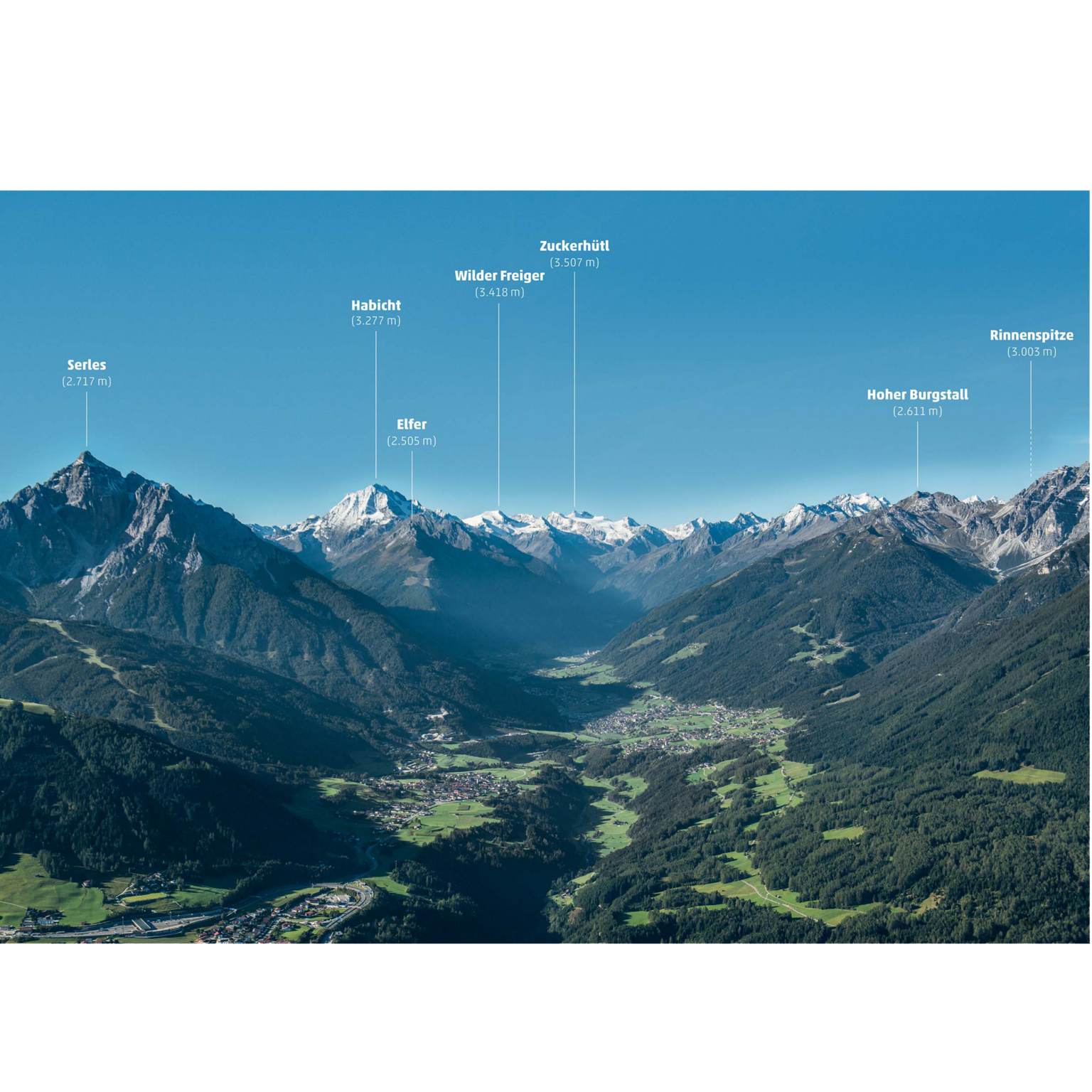 Stubaital: Hiking in summer Panoramic view of the Dolomites with labeled peaks and green valleys under a blue sky