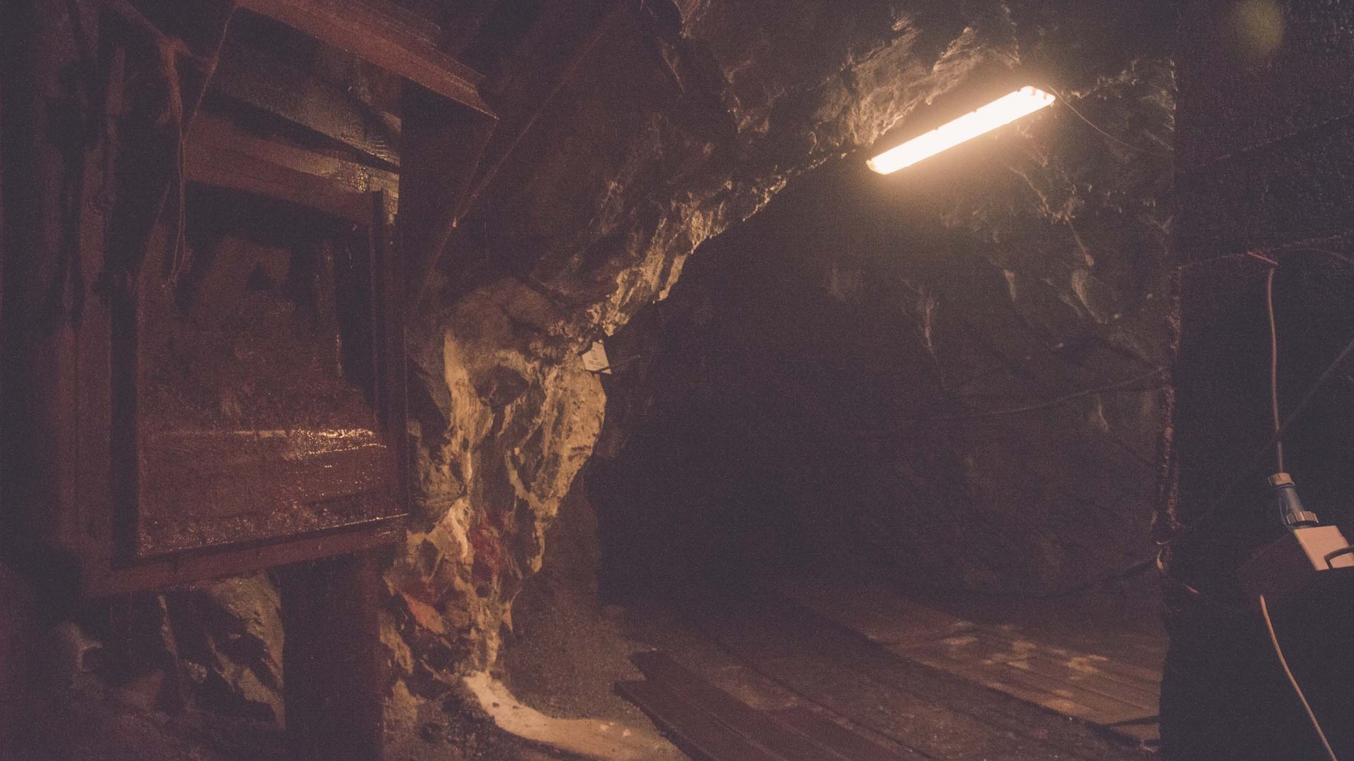 Things to do in Stubaital Dark mine tunnel with a brightly lit area
