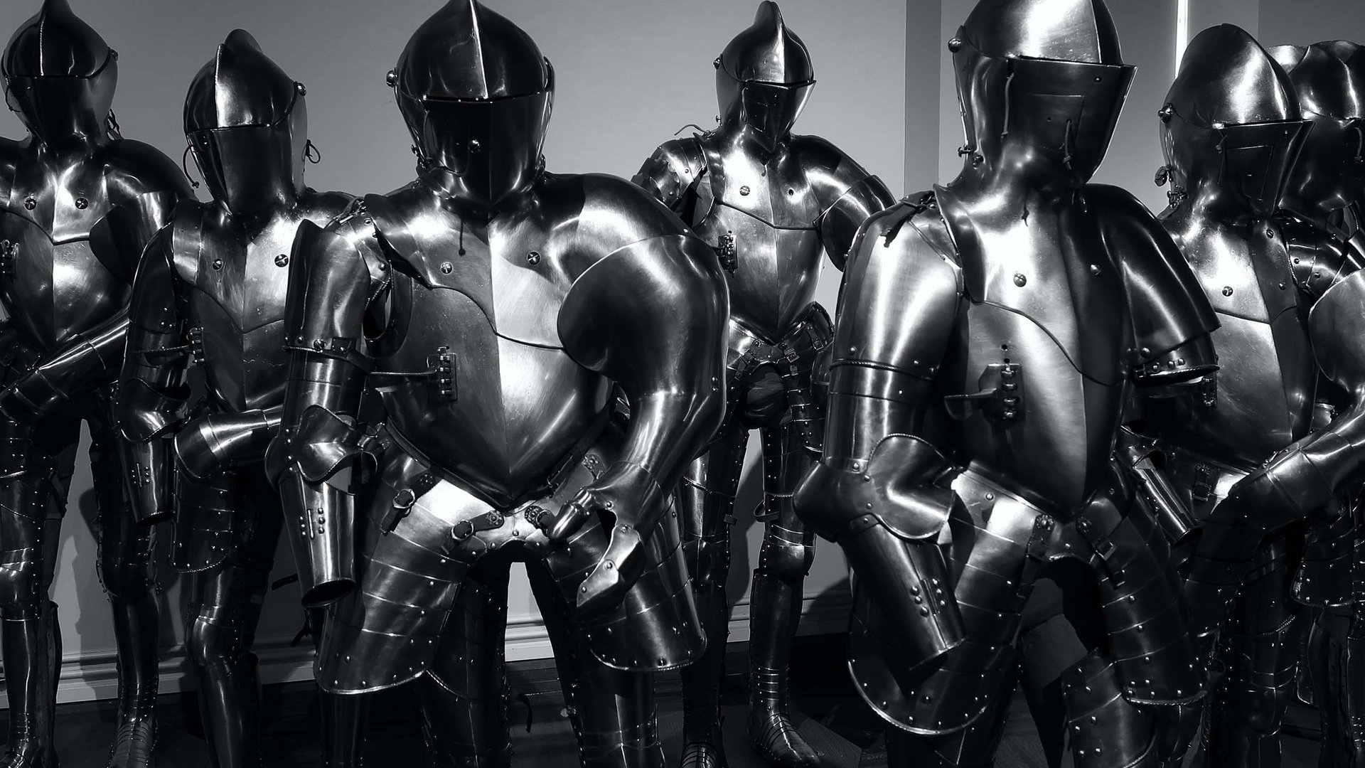 Things to do in Stubaital Row of medieval metal knight armors in a museum